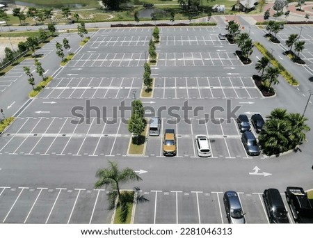 few car at car park in otherwise empty parking lot. almost empty car park. aerial view. Royalty-Free Stock Photo #2281046313