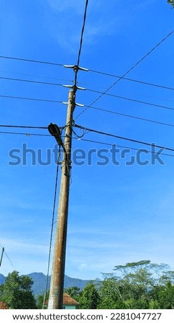 Neat cables with mountain views and clear blue skies, on cool mornings