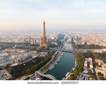 Establishing Aerial view of Paris Cityscape with Eiffel Tower and Seine river on sunrise, France. Landmark Monument as Famous Touristic Destination. Romantic Travel and Urban Skyline Panorama Royalty-Free Stock Photo #2281050257