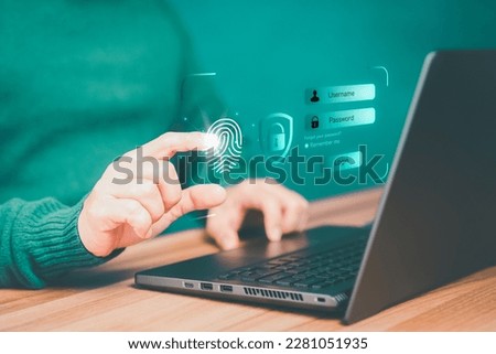 Adult man login with fingerprint scanning technology in the computer laptop. Secure encryption and access to the user's private information to access the internet.