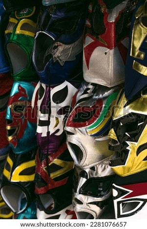 colorful masks of different mexican wrestling wrestlers placed in a street stall in mexico city 