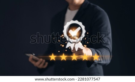Man using his phone with a five-star icon, representing the concept of customer service and satisfaction through feedback, reviews, and ratings. Royalty-Free Stock Photo #2281077547