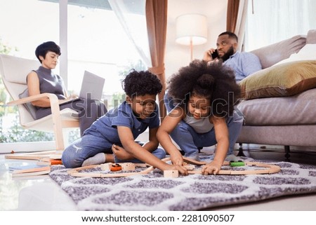 Joyful African American Family Playing with Toys, Perfect for Family-Oriented Projects

