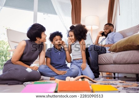 Vibrant Family with Children Playing with Toys, Great for Diversity and Inclusion Campaigns

