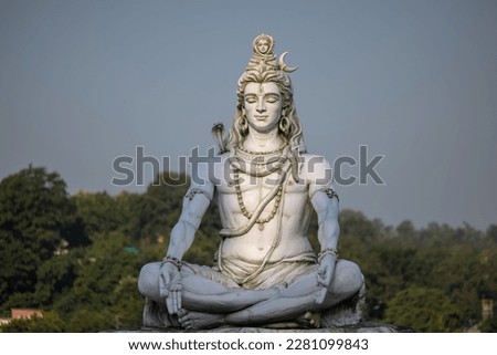 Lord Shiva, Handmade statue of lord shiv with plain background near river ganges ghat in rishikesh. Royalty-Free Stock Photo #2281099843