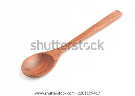 Cutout wooden teaspoon on white background.