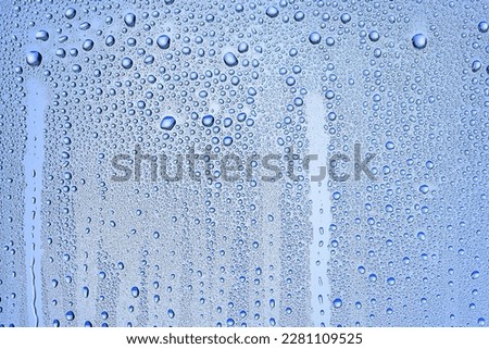 drops glass blue background abstract, transparent cold background water splashes Royalty-Free Stock Photo #2281109525