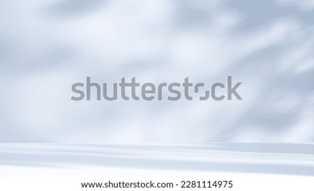 Light blue background for product presentation with a light and shadows pattern on it Royalty-Free Stock Photo #2281114975