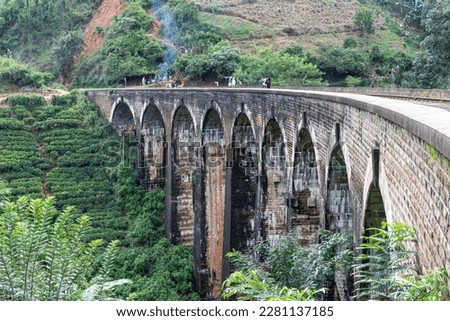 Train ride over mountain railway bridge on green nature landscape - famous nine arches bridge - Sri Lanka Royalty-Free Stock Photo #2281137185