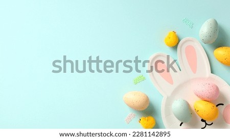 Happy Easter banner. Easter eggs and plate in form of Easter bunny on blue background.