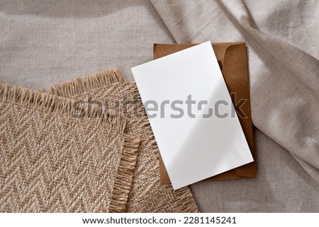 Aesthetic classic minimalist business branding template, blank paper card with mock up copy space and abstract sunlight shadows on a warm neutral beige background