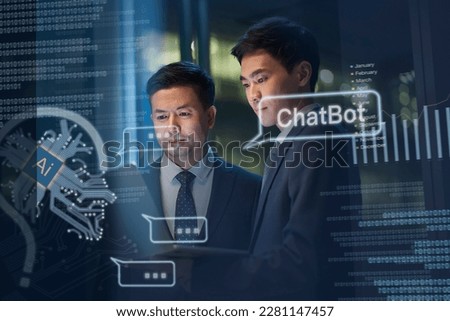 two asian business man working together using laptop computer getting help from AI ChatBot Royalty-Free Stock Photo #2281147457