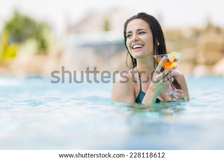 Pretty young woman in the pool