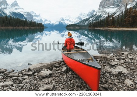 Scenery of Spirit Island with female traveler on kayak by the Maligne Lake in the morning at Jasper national park, AB, Canada Royalty-Free Stock Photo #2281188241