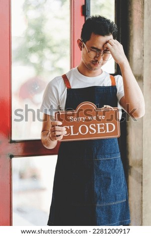 small business Turned closed sign. Crisis concept. Owner closed sign on bar or restaurant glass door or window.