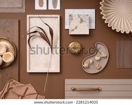 Elegant  flat lay composition in brown and beige color palette with textile and paint samples, lamella panels and tiles. Architect and interior designer moodboard. Top view. Copy space.