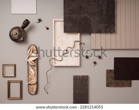 Elegant flat lay composition with textile and paint samples, panels and cement tiles. Stylish interior designer moodboard. Light beige and gray color palette. Copy space. Template. 