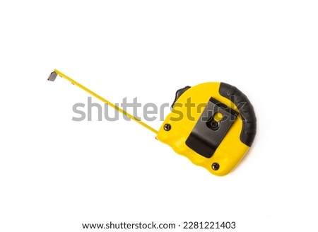 Yellow measuring tape isolated on white background. Construction concept. Builder's tools. Royalty-Free Stock Photo #2281221403