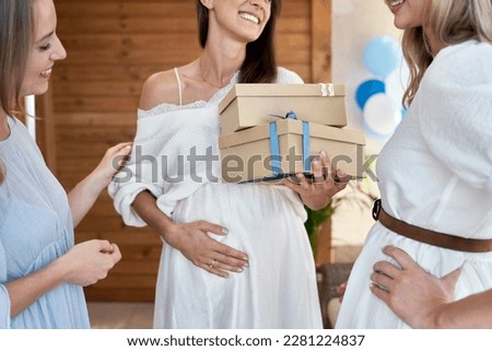 Part of woman in pregnant with her friend at baby shower  Royalty-Free Stock Photo #2281224837