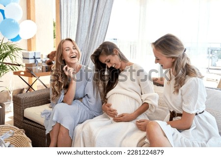 Group of women spending time together at baby shower  Royalty-Free Stock Photo #2281224879
