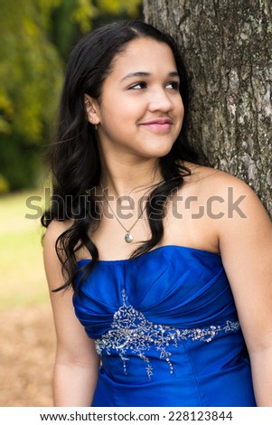 Teen girl wearing her formal Quinceanera dress