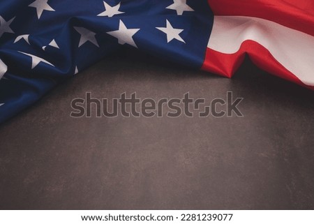 Part of the American flag is on a vintage background with copy space for text. Top view. Close-up photo
