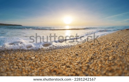 Sea foam on the beach of seashore. Nature landscape scene.
