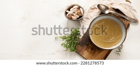 Broth in Bowl on gray background, healthy food, top view, copy space, panorama, banner,