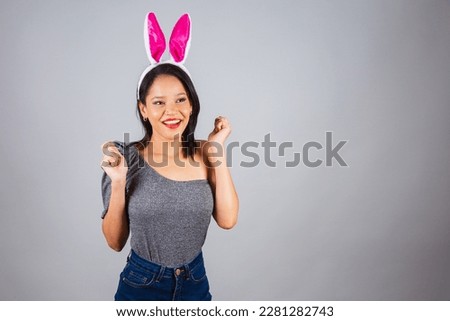 Brazilian woman, northeastern, wearing bunny ears, photo for Easter. cheering, wishing and wanting.
