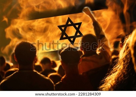 Protests Israel Tel Aviv. Israel flag. Protest in Israel 2023. Rise hand. Defense minister. Fire, flame, revolution. Out of focus. Royalty-Free Stock Photo #2281284309