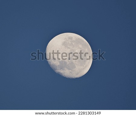 Waning moon in a blue sky