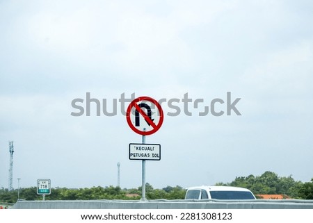 A No U-turn road sign. Road signs on Indonesian toll roads