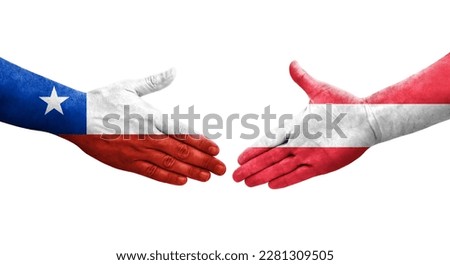 Handshake between Austria and Chile flags painted on hands, isolated transparent image.