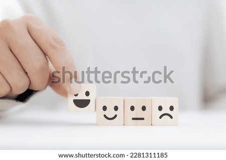 Satisfaction evaluation form concept and customer service, feedback, client, businessman chooses wooden block showing very satisfied Royalty-Free Stock Photo #2281311185
