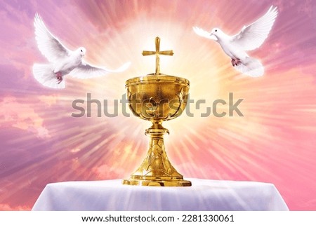 Chalice with crucifix in an altar with flying doves. Holy eucharist theme concept. Royalty-Free Stock Photo #2281330061