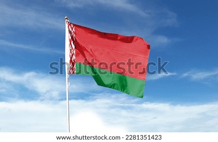 Belarus flag on cloudy sky. waving in the sky Royalty-Free Stock Photo #2281351423