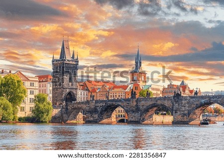 Prague - Charles bridge, Czech Republic. Scenic aerial sunset on the architecture of the Old Town Pier and Charles Bridge over the Vltava River in Prague, Czech Republic.