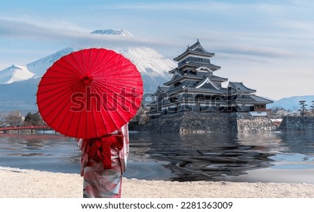 japanese castle in tokyo with cherry blossom, traveller woman in Kimono traditional dress, Fuji mountain blue sky and reflec of castle in river , Tokyo city, Japan Royalty-Free Stock Photo #2281363009