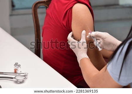 Preventive vaccination The doctor will give the injection to the patient. concept of treatment, prevention, illness Royalty-Free Stock Photo #2281369135