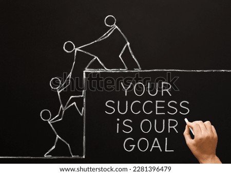 Hand writing motivational quote Your Success Is Our Goal with chalk on blackboard. Concept about teamwork, leadership, helping others, or support. Royalty-Free Stock Photo #2281396479