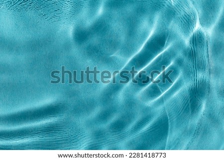 Calm water in pool with sunlight. The concept of peace and relaxation. Close-up, selective focusing, defocusing Royalty-Free Stock Photo #2281418773