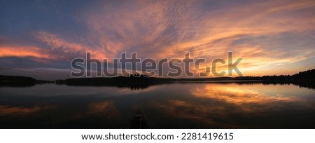 Canoeing in the setting sun on lake "Wurlsee" - panorama from 9 pictures