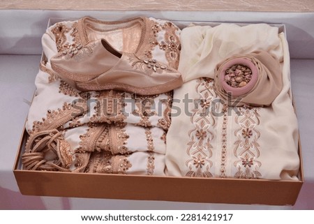 Moroccan Tyafer, traditional gift containers for the wedding ceremony, decorated with ornate golden embroidery.Moroccan henna .Moroccan wedding gifts for the bride
 Royalty-Free Stock Photo #2281421917