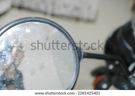 picture of dirty mirror from motorcycle 