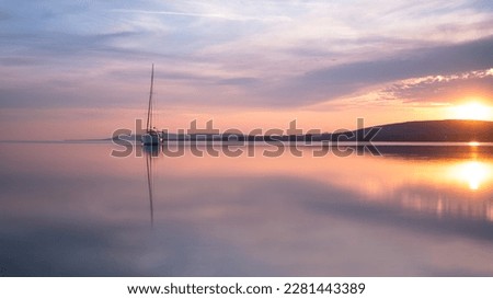 i took this picture of a sailing boat at sunset, it was located on the peninsula tihany on lake balaton in hungary Royalty-Free Stock Photo #2281443389