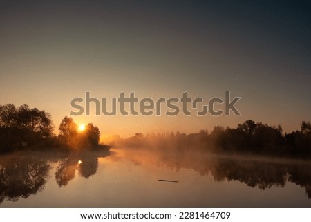 Morning fog on the lake, sunrise shot.