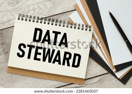 Data steward - text on a notepad with a spring near the pen