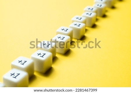 Sequential chain of blocks with plus one. Sequence. Arithmetic progression. Add one more. Increase and growth. A series concept. Accumulation process. Continuation. Sequential addition to the sum. Royalty-Free Stock Photo #2281467399