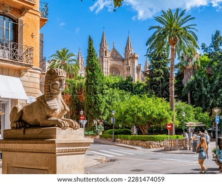 Sphinx statue on Passeig del Born street with Cathedral at background, Palma de Mallorca, Balearic islands, Spain Royalty-Free Stock Photo #2281474059