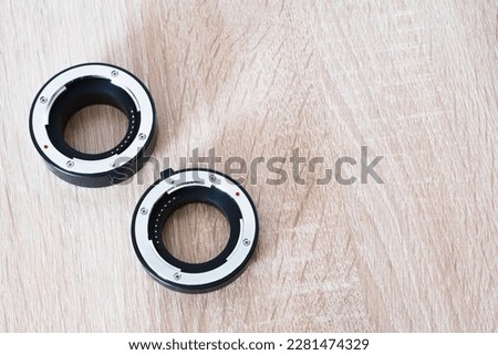macro photo rings on wooden table, photography theme, visual communication, top side view, horizontal position